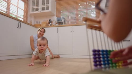 Baby Crawling with Parent in Bright Kitchen