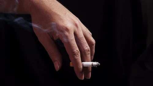 Hand Holding a Lit Cigarette, Close Up, Smoking