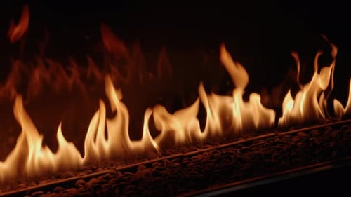 Real-time gas-powered flames flicker from a luxury gas fire place. The flames create a dramatic and
