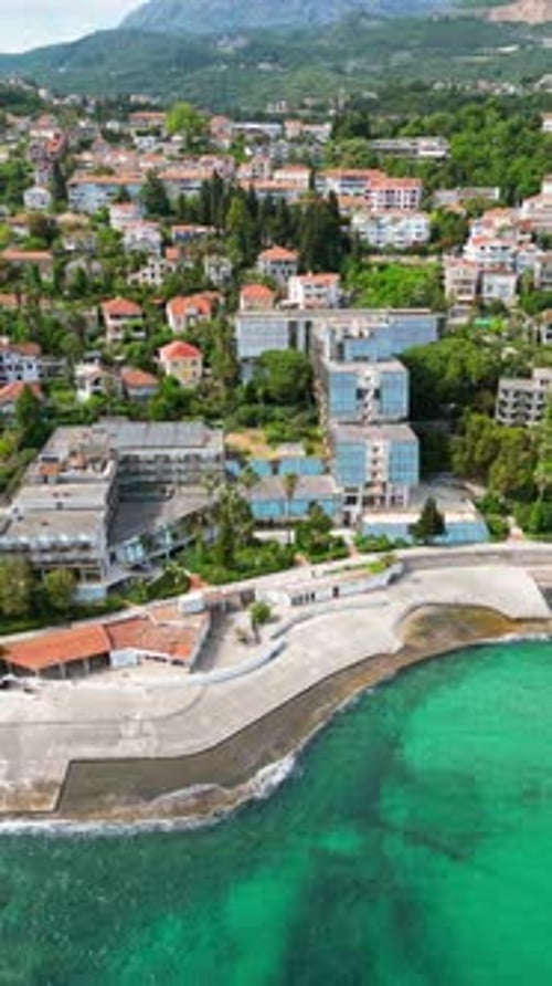 Aerial, drone view of buildings on the shore of the Adriatic sea in Croatia. Vertical