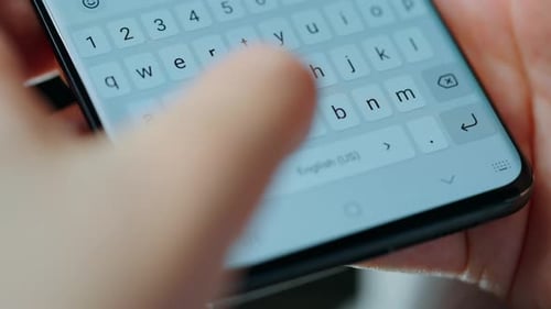 Female Hands Typing Text on Smartphone Closeup