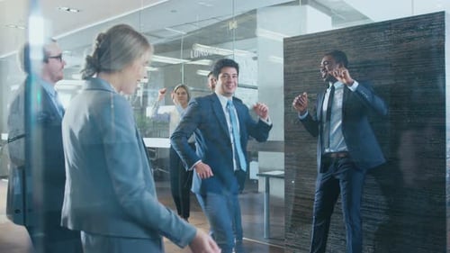 Team Celebrates, Dancing in Modern Office Building