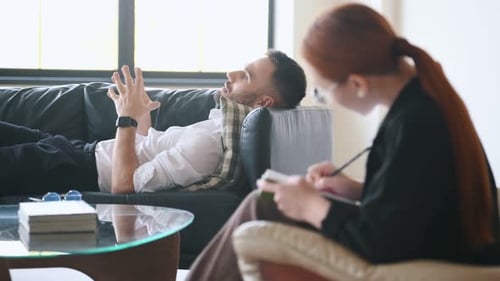 Man Talking to Therapist During Counseling Session