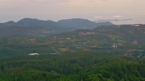 Aerial Expansive Green Mountains and Valleys with Villages Scenic Countryside