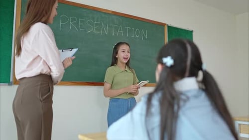 Young Student Giving a Presentation in Class