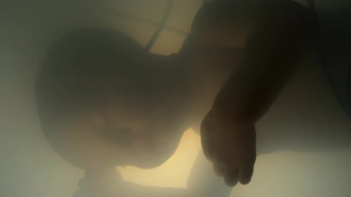 Person Underwater, Murky and Obscured