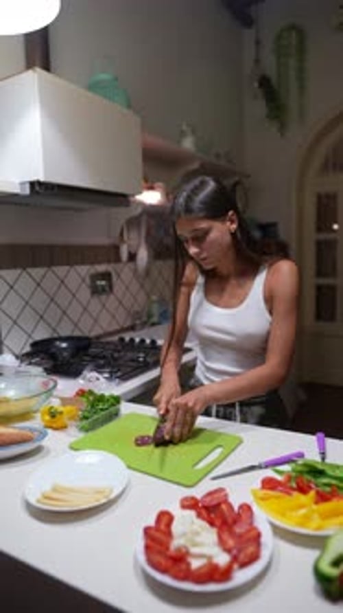 Young Woman Preparing Food in Bright Kitchen