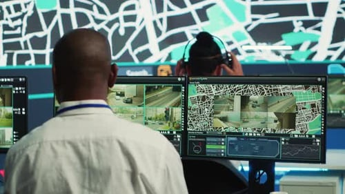 People Monitoring City Street Traffic at Workstations