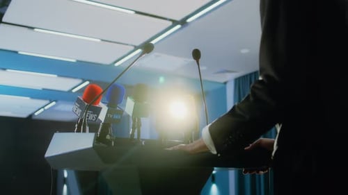 Politician Giving Press Conference at Podium