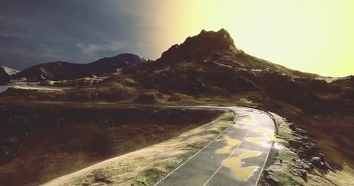 Majestic Mountain Landscape with a Winding Road at Sunset Glow