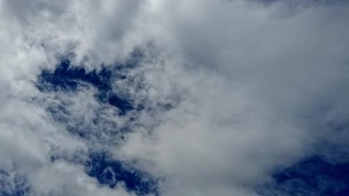 Timelapse of clouds against a bright blue sky