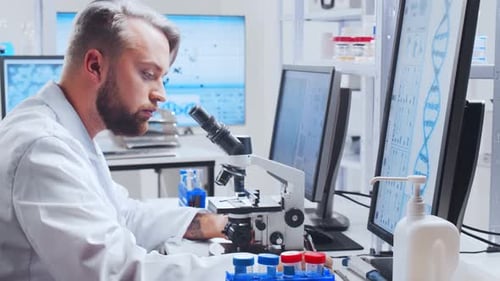 Scientist Using Microscope for DNA Research in Laboratory