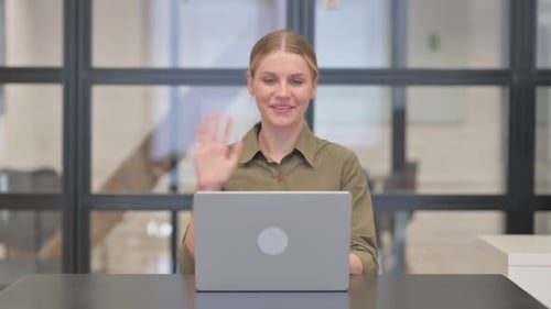 Woman On Video Call At Modern Workplace