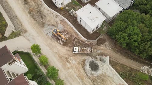 Construction Site Aerial View with Excavator and Truck