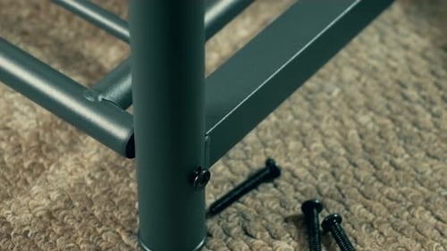 Man Structuring Furniture Frame Table or Adjust Wardrobe Using Screwdriver Craftsman Hands