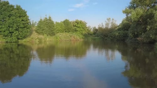 Beautiful spring landscape with small pond.