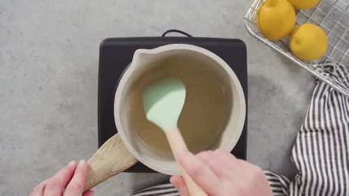 Flat Lay Cooking Cake Syrup for Cake in a Saucepan