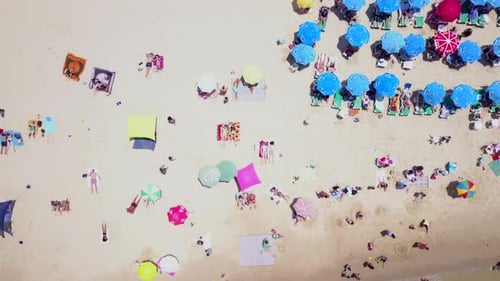 Mediterranean beach during summer with people in the water