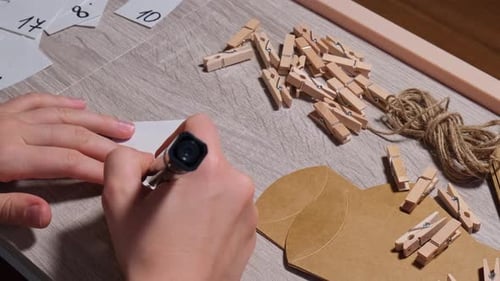 Crafting materials for gift on wooden table