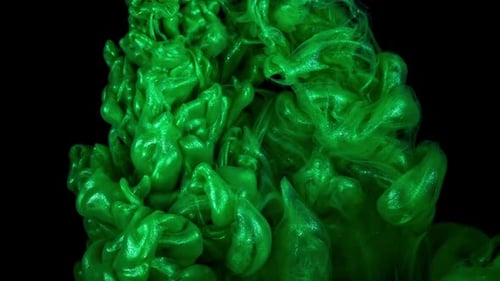 Serene Aqua Dance Green Ink Drops Softly Swirl and Mix in Water Set Against a Black Background