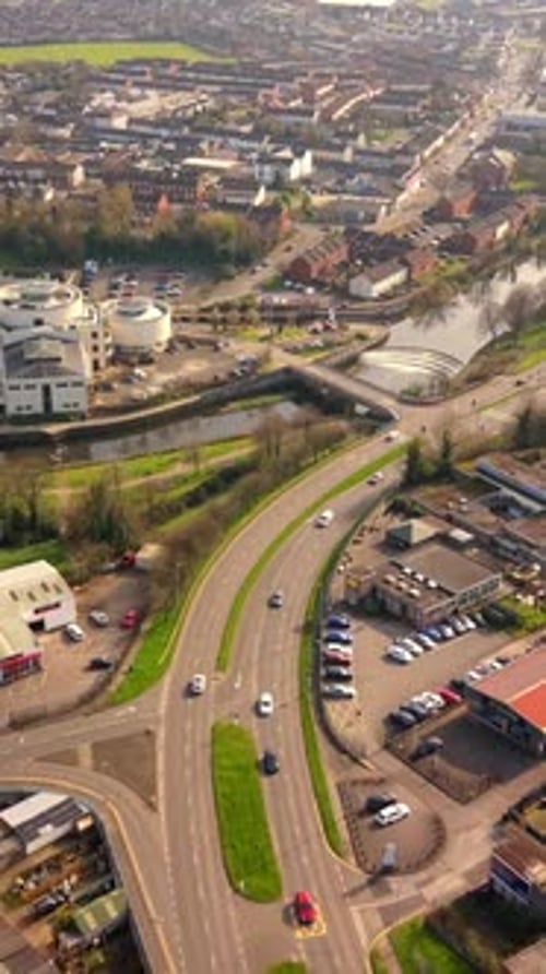 Reversing 60FPS vertical social ratio aerial GV of Lisburn City Centre in Lisburn, County Antrim