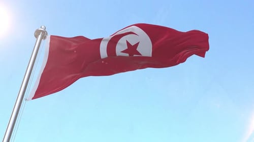 Tunisian National Flag Waving in Blue Sky