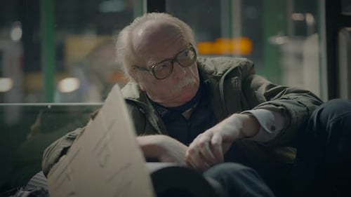 Elderly Homeless Man Suffering From Poverty Looking for Help at Train Station