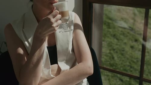 Girl Near Window Drinks Coffee Stylish Model Enjoys Drink And View From Window