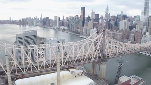 Cinematic 4K Aerial orbit of Queensboro Bridge NYC east river and Hudson