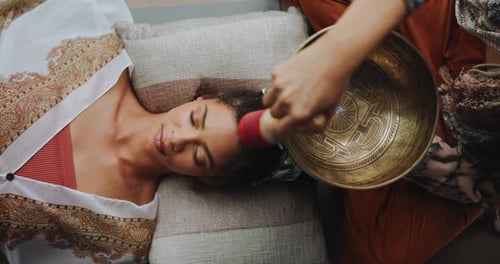 Meditation, singing bowl and woman on floor with healer for sound therapy