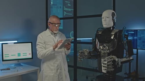 Mature Engineer Testing Humanoid Robot in Lab