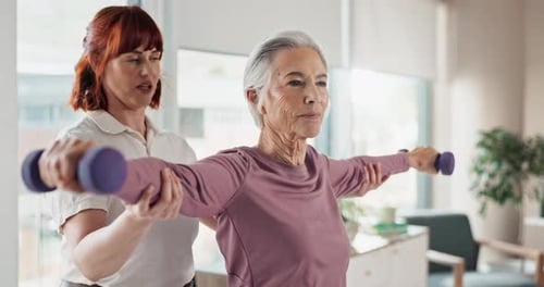 Senior Woman Working Out with Personal Trainer