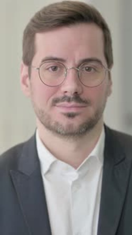 Man In Suit Smiles at the Camera, Close Up
