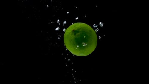 Green Lime Falling in Water Splash