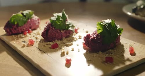 Beet Appetizers Garnished with Parsley and Pomegranate