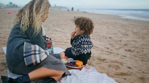 Mom Enjoying Son Picnic on Autumn Ocean Shore Family Spending Time Together