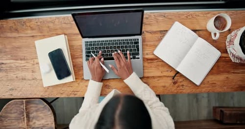 Above, woman and laptop with notebook for remote work, planning and schedule agenda in cafe