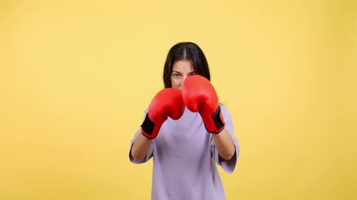 Woman Wearing Boxing Gloves Stances in Fighting Position