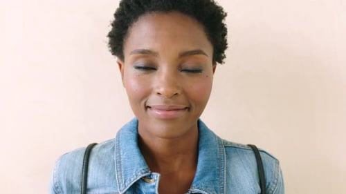 Young Woman Smiling Directly At Camera Close-Up