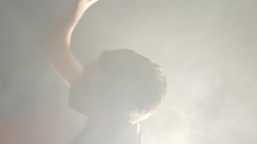 Elegant Dancer in Smoky Studio, Close Up