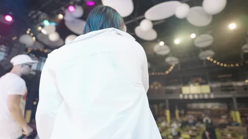 Woman Performs Live Music with Band at Night