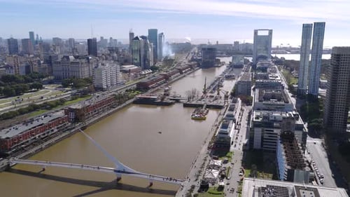 Drone aerial view of Puerto Madero canal and skyscrapers in Buenos Aires Argentina.