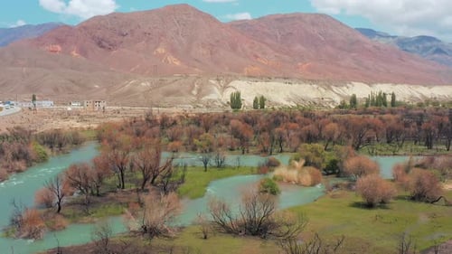 Smoothly descending drone aerial view of grandiose landscape of mountain ranges