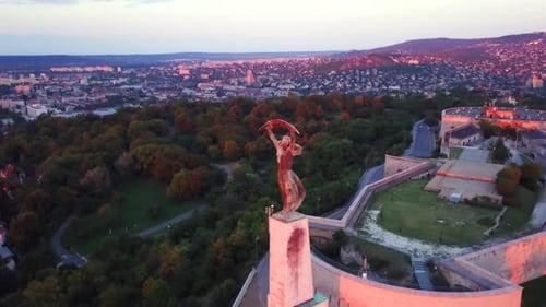Budapest liberty statue and view of the early sun over the city