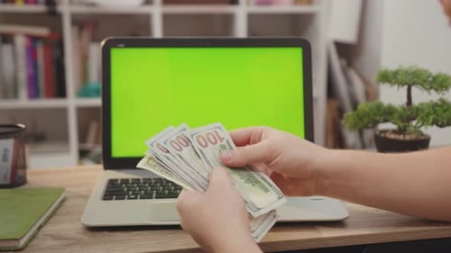 NEW YORK April 5 2019 Close Up Hands Man Use Laptop Computer with Green Screen Chroma Key Display