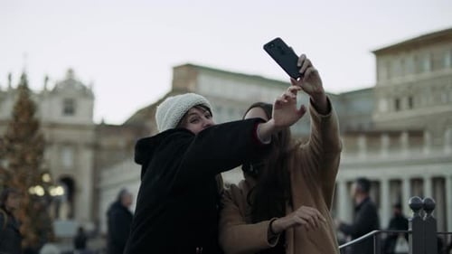 Two Excited Italian Friends Looking Out at St Peter'S Basilica in St