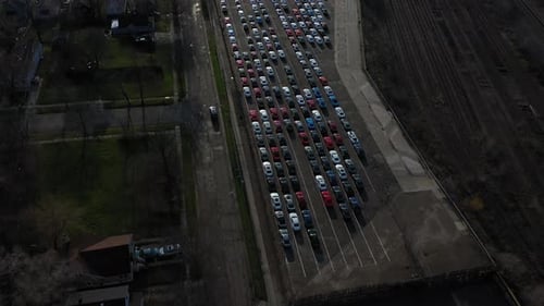 Aerial Reveal of Cars at Automotive Plant