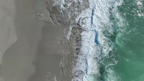 Aerial Video Intense Ocean Storm Brings Dramatic Waves and Intricate Foam to the Coast