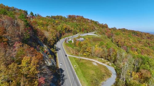 Wide Highway Road in North Carolina Leading Through Appalachian Mountains with Yellow Fall Forest