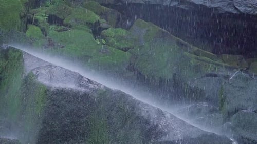 Waterfall Falling on Mossy Rock Slow Motion